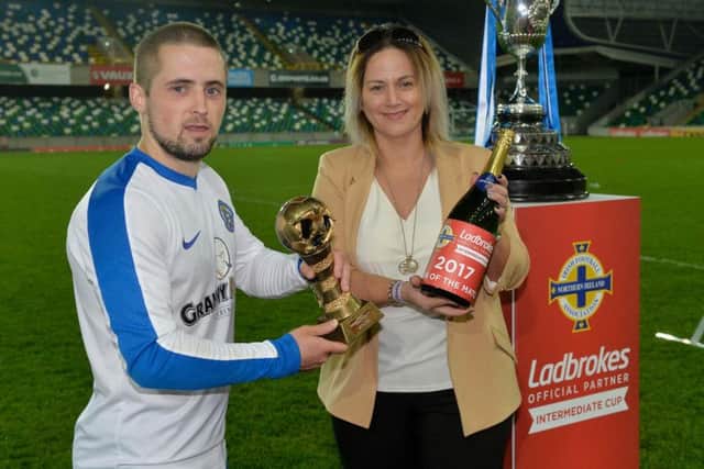 Man of the Match, Limavady striker Robbie Hume, receives his award from Ladbrokes' Shelly McDaid.