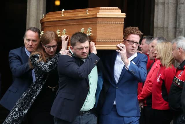 The coffin of Brendan Duddy leaves St Eugene's Cathedral in Derry after Requiem Mass.