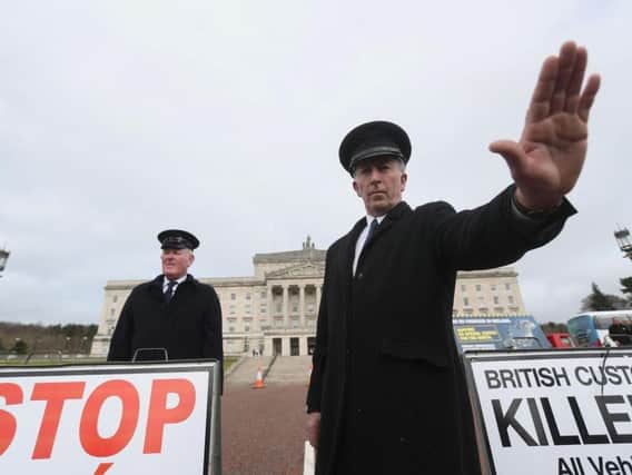 Anti-Brexit campaigners dressed as customs officers, protest outside Stormont in Belfast recently.
