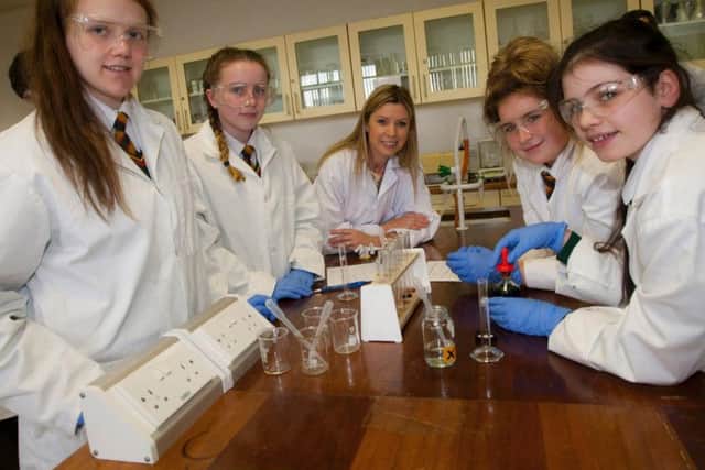Pupils from St Mary's LImavady take part in the Salters Festival at North West Regional College. From left are Caoimhe MUllan, Rianna Donaghy, NWRC Lecturer Teresa Harris, Lydia Mullan and Leah Kelly.