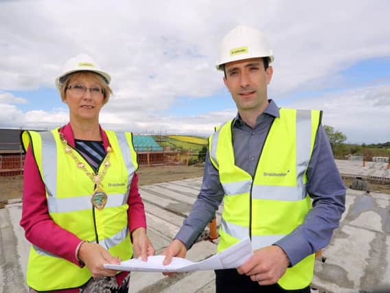 Mayor of Derry City and Strabane District Council, Alderman Hilary McClintock, and Joe McGinnis, Managing Director of Braidwater, pictured on site at Ashbrook Court in Drumahoe, Derry.