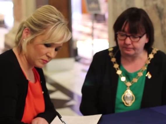 Sinn Fein leader, Michelle O'Neill adds her signature to the book of condolence dedicated to all those affected by the terror attack in Manchester.