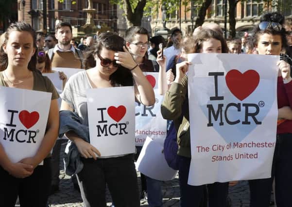 People in Albert Square, Manchester earlier this week.  Photo credit: Martin Rickett/PA Wire