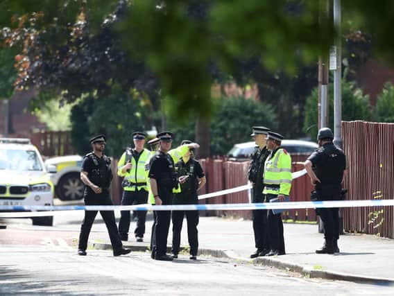 Police activity at a cordon in the Hulme area of Manchester. (Photo: P.A.)