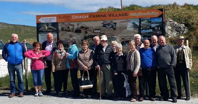 Pictured at the entrance to the Famine village in Doagh  from left to right - John James Kelly, Margaret Loughery, Mervyn Scott, Anna Murphy, Ida Canning,  Mary Brolly, Mick McNicholl, Mervyn Murphy, Fidelis McNicholl, Nola Johnston, Noelle Murphy, Aidan Farren, Brendan McCann, Mickey Brolly, Chris McFlynn and Ivor Canning
