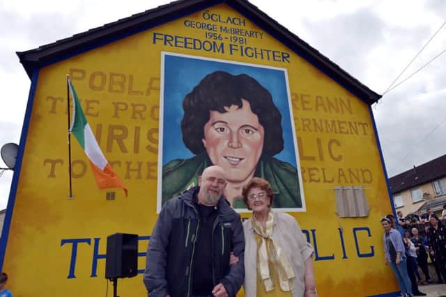 Mrs Bridie McBrearty pictured with Bogside Artist Kevin Hasson at the recent unveiling of a mural in Rathkeele Way in memory of her son and IRA Volunteer George who was shot dead by members of the SAS while on active service in 1981. DER2217GS002