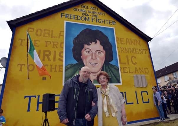 Mrs Bridie McBrearty pictured with Bogside Artist Kevin Hasson at the recent unveiling of a mural in Rathkeele Way in memory of her son and IRA Volunteer George who was shot dead by members of the SAS while on active service in 1981. DER2217GS002