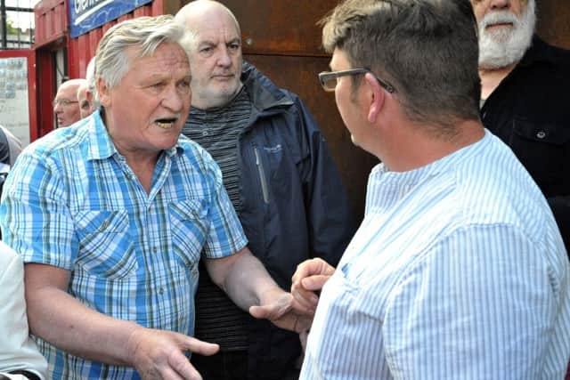 Micheal Bridge, who was wounded in Bloody Sunday speaking with Colm Barton, from the Museum of Free Derry, during a demonstration, outside the Museum of Free Derry, calling for the removal of names of dead British soldiers that are included in an exhibit in the Bogside exhibition space. DER2217GS034