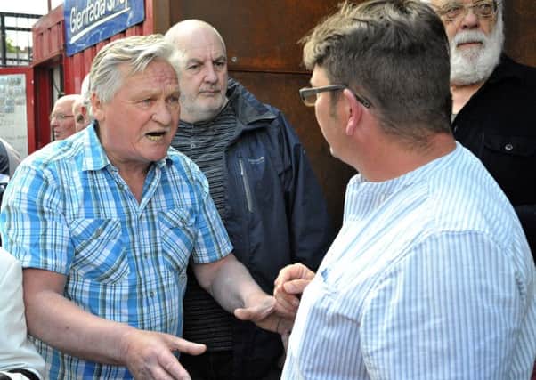 Micheal Bridge, who was wounded in Bloody Sunday speaking with Colm Barton, from the Museum of Free Derry, during a demonstration, outside the Museum of Free Derry, calling for the removal of names of dead British soldiers that are included in an exhibit in the Bogside exhibition space. DER2217GS034