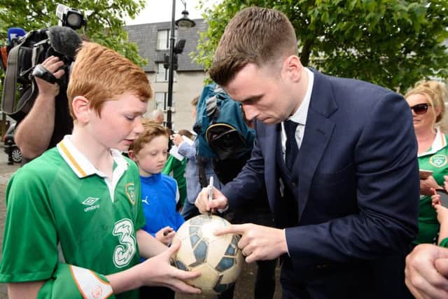 James Tourish getting his Football and Shirt signed by Seamus Coleman who was awarded the Freedom of the County by Donegal County Council at a Civic Reception hosted by Cathaoirleach Cllr. Terence Slowey at the County House in Lifford  Photo Clive Wasson