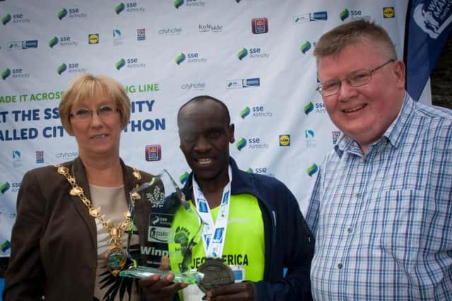 The winner of the 2017 SSE Airtricity Walled City Marathon Dan Tanui pictured with the Mayor of Derry City and Strabane District Council, Alderman Hilary McClintock and Andrew Greer, General Manager, SSE Airtricity, sponsors of the event.