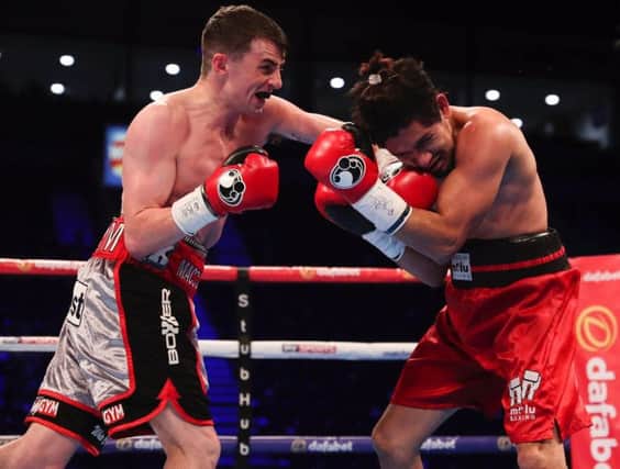 Derry super bantamweight lands a heavy left hook on his way to his seventh professional win at the Odyssey Arena, Belfast on Saturday night.