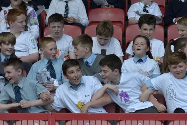 Primary school pupils from the Diocese of Derry pictured at the recent Fan the Flame open air mass held in Celtic Park. DER23217GS045