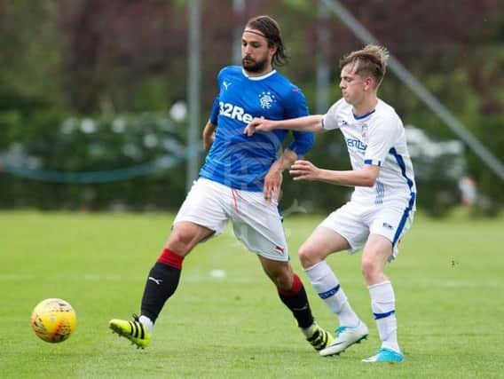 Rangers midfielder Niko Kranjcar holds off Ciaron Harkin during a recent friendly, in Scotland.