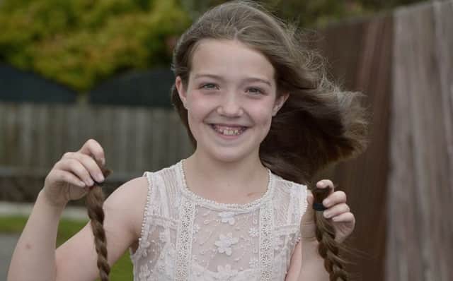 Ten-year-old Ellie Doherty pictured after she had 12 of her hair cut off to be made into wigs for chemotherapy patients.  DER2517GS077