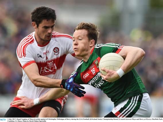 Mayo's Donal Vaughan up against Chrissy McKaigue during theAll-Ireland Senior Championship Round 2A match in Elverys MacHale Park,Castlebar.