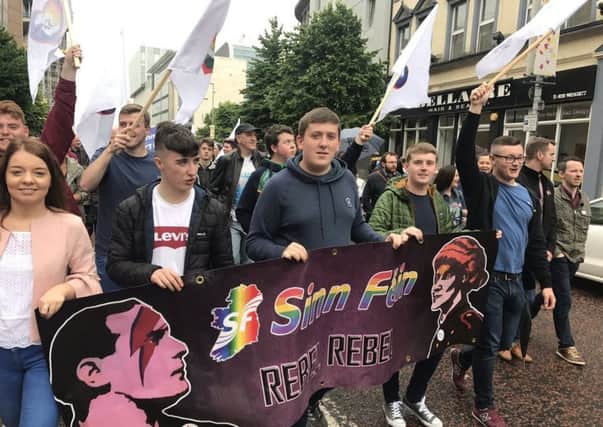 CaolÃ¡n McGinley (fourth from left) alongside members of Sinn FÃ©in Youth from Derry taking part in Saturday's march in Belfast.