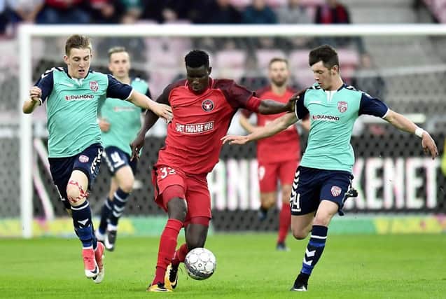 FC Midtjylland boss, Jess Thorup heaped praise on Derry youngsters, Rory Holden and Ronan Curtis, pictured attempting to dispossess Midtjylland's Paul Onuacho. (Picture by Bo Amstrup).