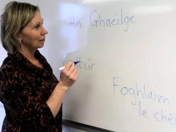 Linda Irvine writing in Irish.