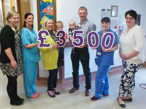 Pictured at the cheque presentation are Claire and Trevor with their sons, Robbie and Peter along with Neonatal staff; Dr Karen Bell; Cathy McClafferty, Nursery Nurse; Nicola Martin, Staff Nurse and Angela Hughes, Nurse Practitioner.