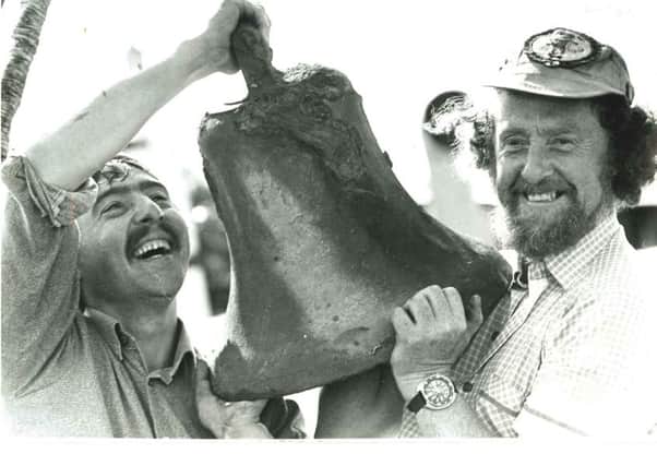 Des and Ray Cossum pictured with the Laurentic bell during a salvage operation in 1979.