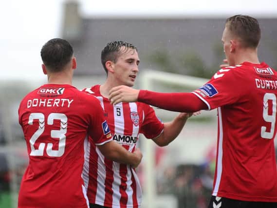 Derry's Aaron McEneff is congratulated by team mates for his assist in the opening goal.