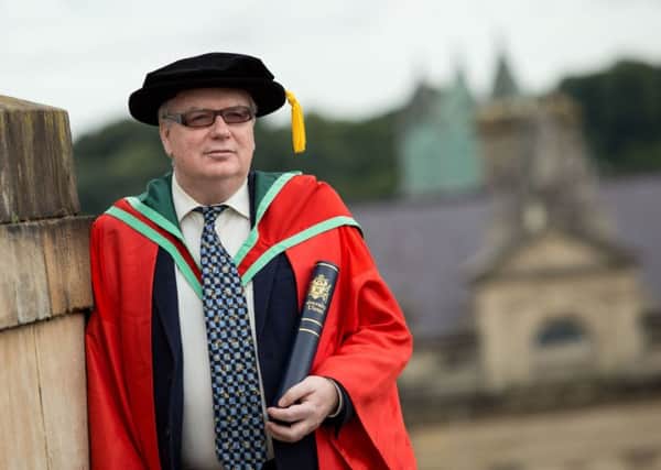 Sean Doran received an honorary degree from UU at Derrys Millennium Forum.