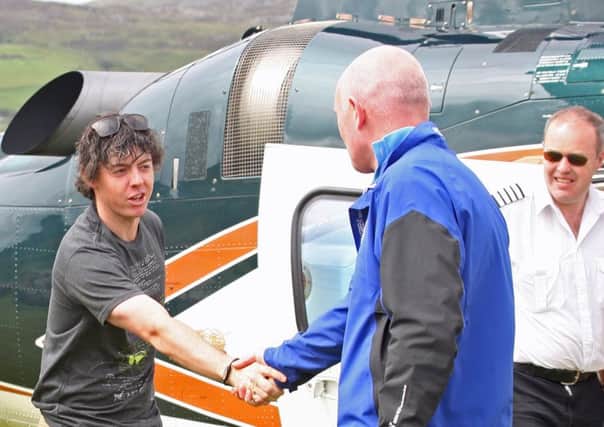 TOUCH DOWN!. . . Ballyliffin Golf Club general manager John Farren welcomes Rory McIlroy to the Inishowen Links after he touched down in 2011 as US Open champion. 2406JM43