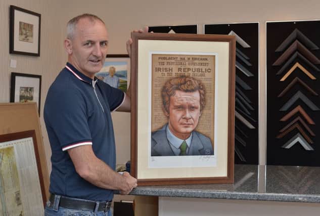 Paul McGilloway, proprietor of Framed to Perfection, holds one of the new 500 limited edition signed portrait prints of Martin McGuinness. The portrait, by renowned Irish artist Robert Ballagh, was endorsed by Bernie McGuinness.  DER2817GS