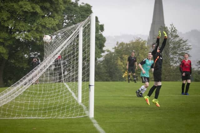 Tobermore goalkeeper Matthew Clark looks back as this 25 yard lob lands in the back of the nets in the U15 game against Derry City