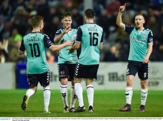 MORE OF THE SAME PLEASE . . Derry City frontman, Nathan Boyle, second right, is congratulated by teammates after scoring his side's second goal in the 4-1 away win against Bohemians last February.