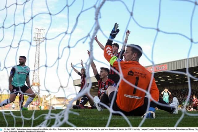 Bohemians players appeal for offside after Rory Patterson's strike was flicked into the net by Nathan Boyle.