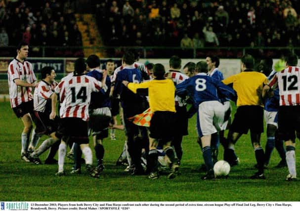 BAD BLOOD . . . Derry City and Finn Harps players confront each other during the second period of extra-time in the eircom league Play-off Final second leg at Brandywell in December 2003 which condemed the Ballybofey men to another season  in the First Division. However, current City boss, Kenny Shiels isnt a fan of derby clashes.