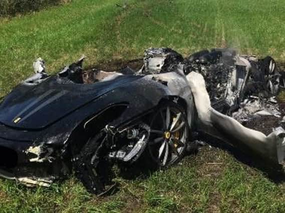 The destroyed car.