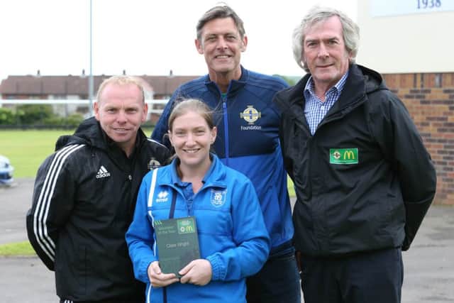 Pat Jennings with Clare Wright and representatives from Trojans FC celebrating her success.