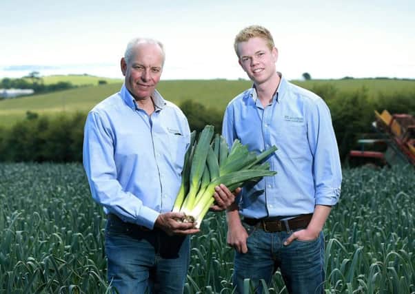 Roy Lyttle and son Alex  in the Bishops Leek Field at their farm