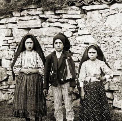 The children of Fatima (l-r) Lucia de Jesus Santos and her cousins Francisco and Jacinta Marto.