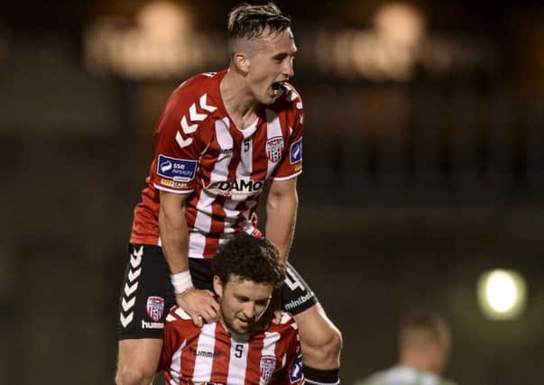 Barry McNamee of Derry City celebrates scoring his side's second goal with team-mate Aaron McEneff.