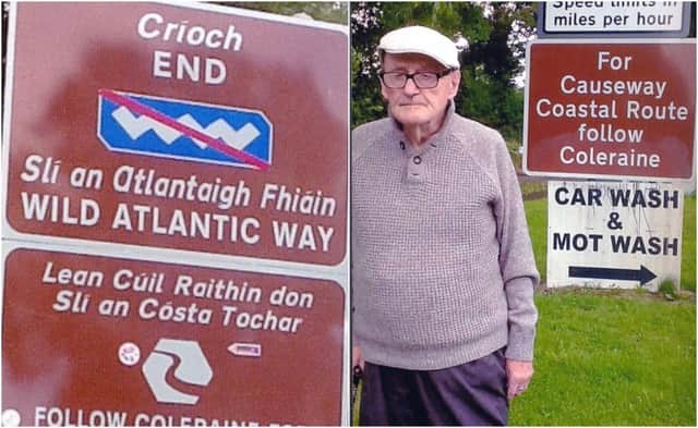 Michael Canavan pictured beside the signs in Muff, County Donegal.