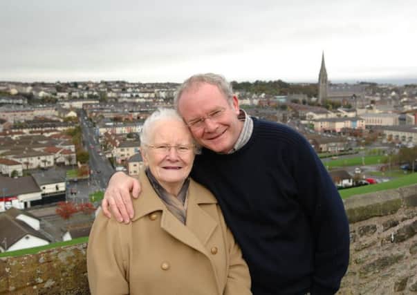 FAMILY MAN... Martin McGuinness pictured with his mother, Peggy, on Derrys historic Walls.