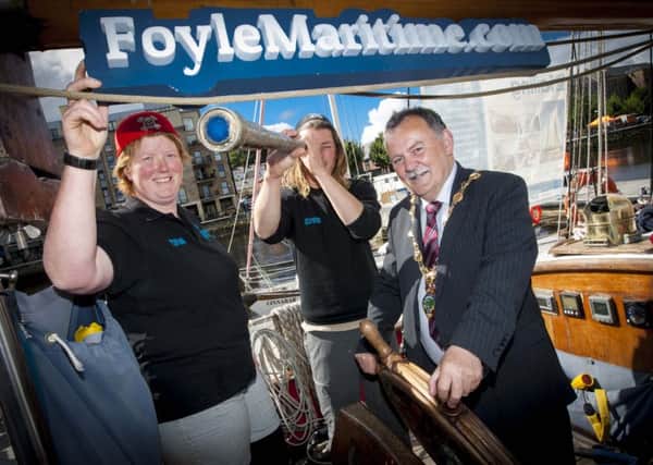 The Mayor of Derry City and Strabane District Council, Councillor Maoliosa McHugh pictured at the Foyle Maritime launch quayside on Friday afternoon. Included with him are Grace Metcalfe, Skipper and Seb Hall, First Mate, Ã¢Â¬ÃœMaybeÃ¢Â¬", one of the tallships anchored portside at the weekend.