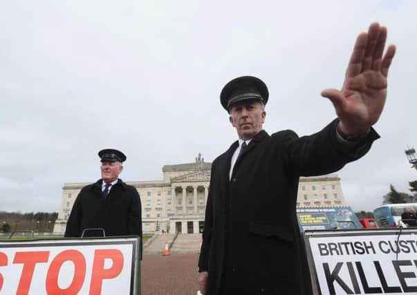 Anti-Brexit campaigners dressed as customs officers, protest outside Stormont in Belfast recently.