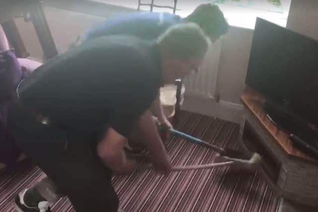 The older of the two men in the video actually breaks a brush in his attempt to catch the mouse. (Photo: Rachel Cochrane)