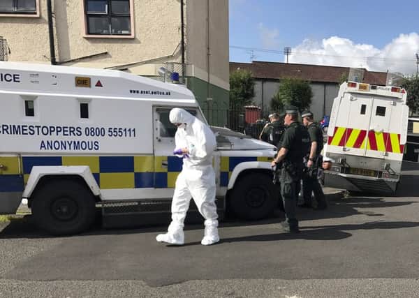 Forensic officer in Lisfannon Park in the Bogside where a 33-year-old man was shot four times on August 8. DER3217GS072