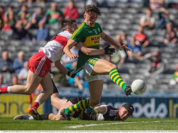 David Clifford of Kerry, after beating the derry goalkeeper Oran Hartin and full back Conor McCluskey, shoots to score his side's second goal in the 14th minute of the Electric Ireland GAA Football All-Ireland Minor Championship Final match between Kerry and Derry at Croke Park in Dublin.