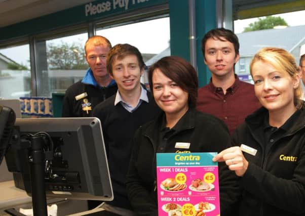 Kevin Doherty (fourth from left) and brother Shane (second from left) with staff at Centra Muff pictured back in 2014 at the opening of the store. DER4114MC034