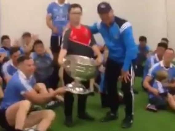 Derry fan, Anton Campbell, pictured Dublin manager, Jim Gavin and the Dublin team.