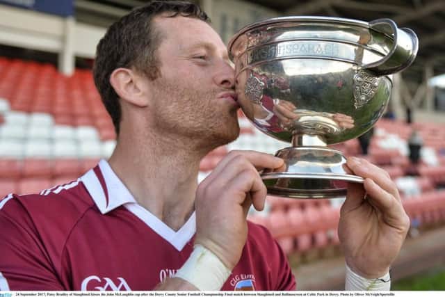 Slaughtneil captain Patsy Bradley kisses the John McLaughlin Cup after the Derry County Senior Football Championship Final in Celtic Park.