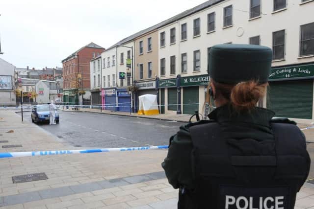 A PSNI officer pictured close to the precise location where Jordan McConomy was fatally assaulted on Sunday. (Photo: Presseye)