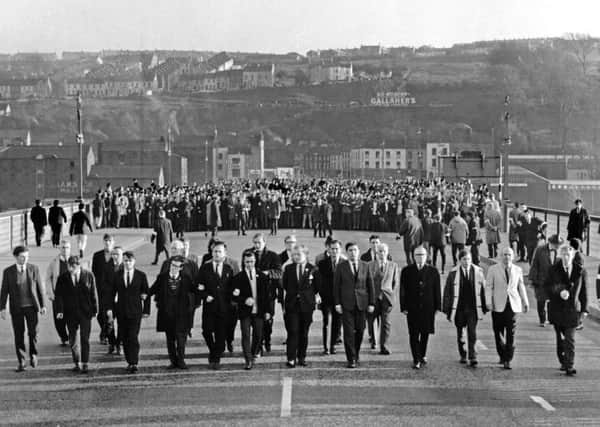 NOVEMBER 1968... A civil rights march makes its way across Criagavon Bridge in Derry. Copyright: Derry Journal.